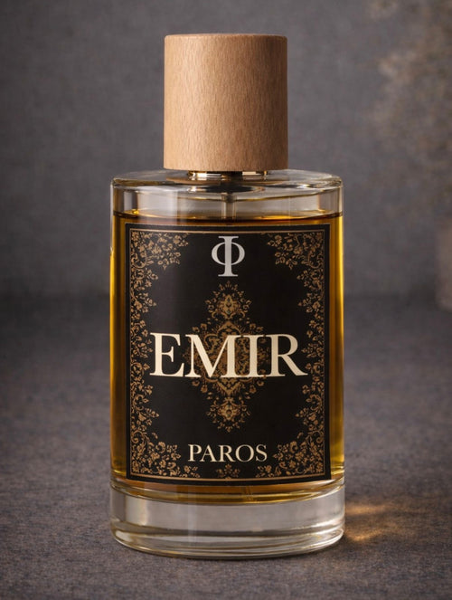 Perfume bottle labeled 'EMIR PAROS' with a dark label and wooden cap on a gray background